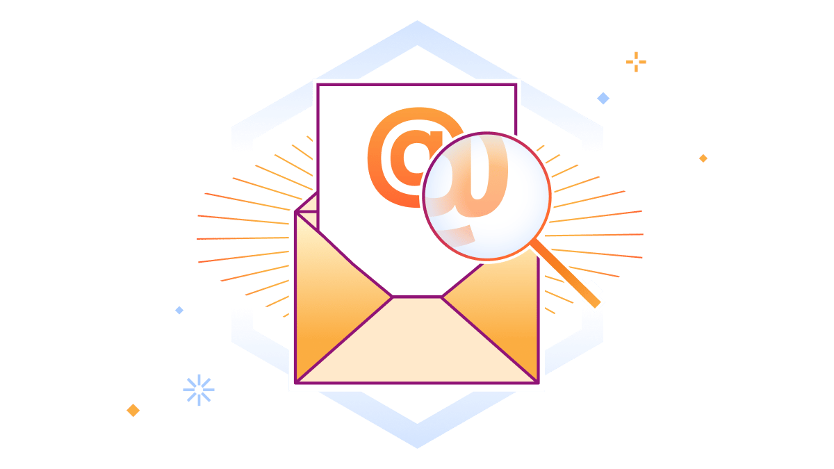 E-Mail-@-Zeichen wird durch eine Lupe vergrößert
